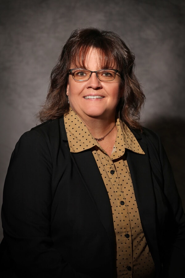 Tami Love, woman with medium length brown hair and glasses